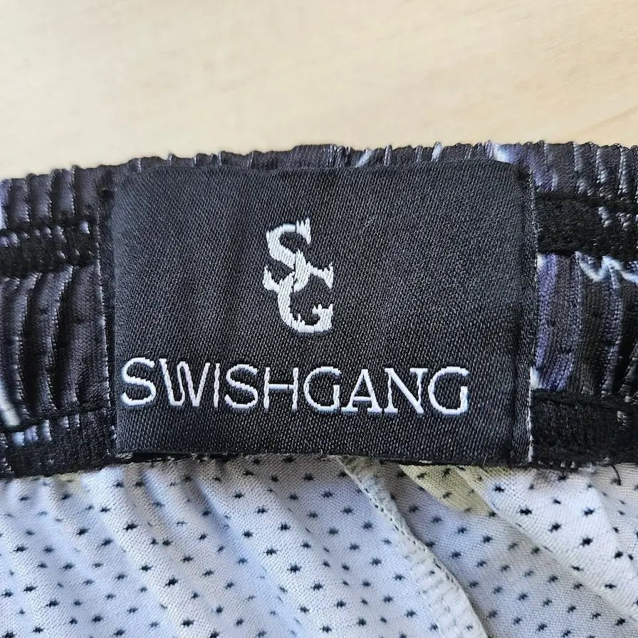 SwishGang woven brand tag detail on black lightning bolt basketball shorts waistband – SwishGang