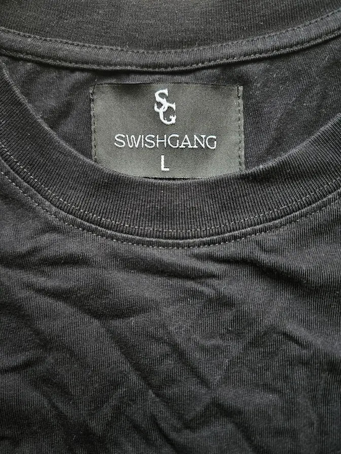SwishGang woven brand tag detail on black cotton t-shirt neckline – SwishGang