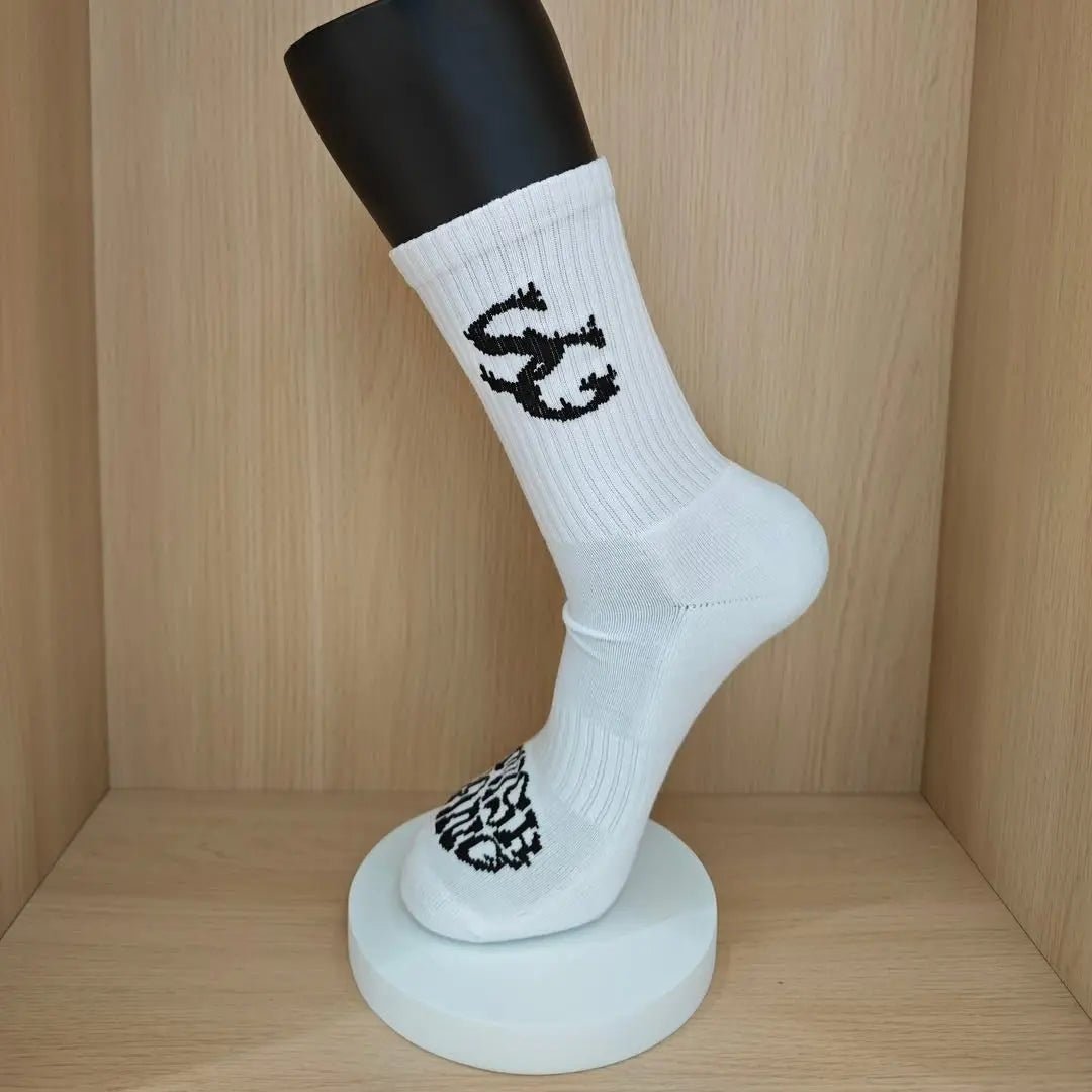 SwishGang white basketball crew socks with black SG logo on mannequin front view